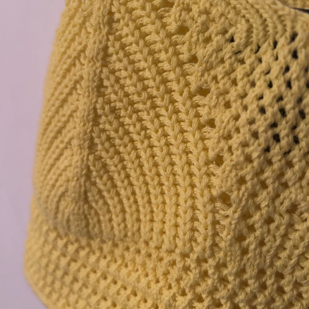 Yellow crochet crop top.